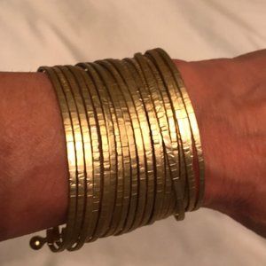 Gold bangle or cuff bracelet. Never worn.